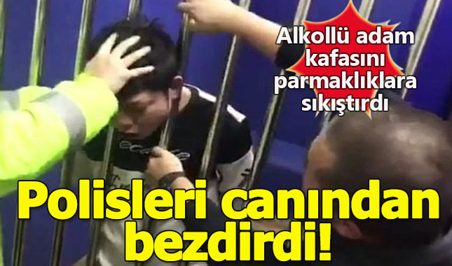 Demir parmaklıkların arasına kafasını sıkıştırmayı başaran Çinli!