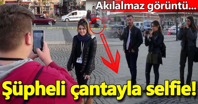 Şüpheli çantayla hatıra fotoğrafı çektirdiler