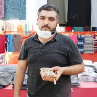Pazarda bulduğu para ve altın dolu cüzdanı sahibine teslim etti