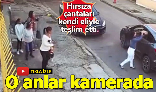 Silahı görünce çantalarını kendi elleriyle hırsıza teslim ettiler