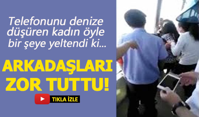 Düşen telefonunun ardından denize atlamak isteyen kadın