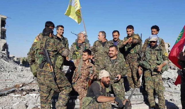 YPG'li teröristler DEAŞ'tan temizledikleri Rakka'yı yağmalıyor